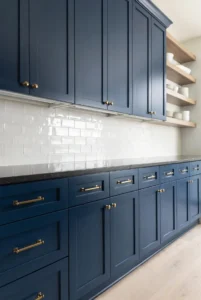 Dark Blue Cabinets with White Backsplash