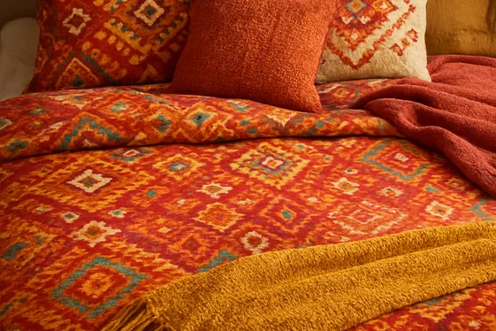 Add Patterned Bedding with Ethnic Prints for Cultural Flair illustration